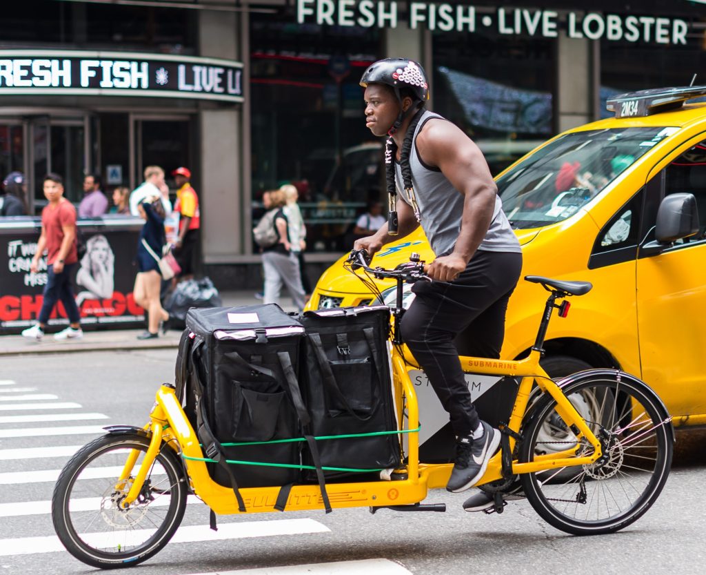 man on a yellow cargo bike