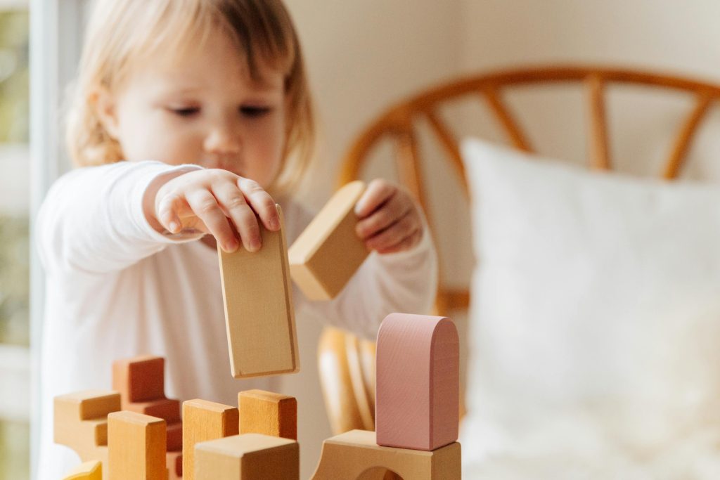 Child playing with wooden blocks